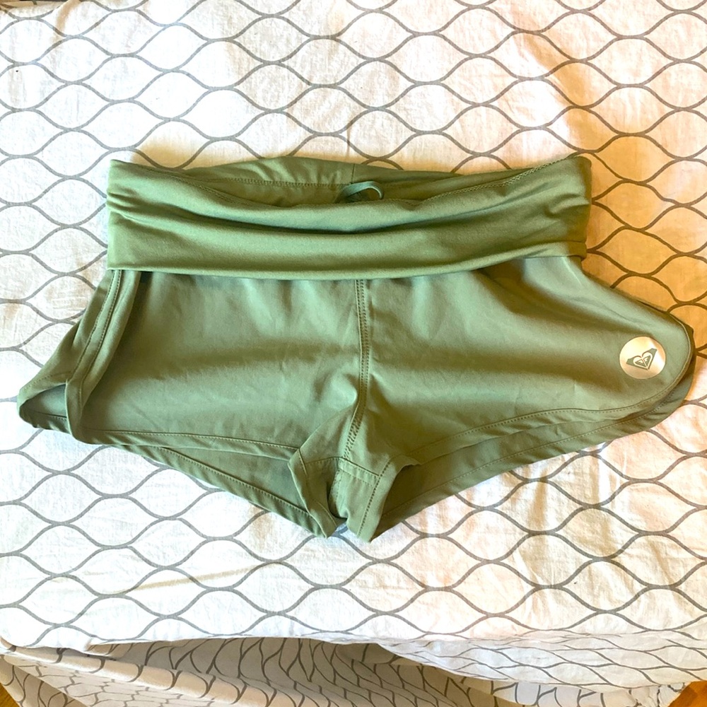 Green Roxy shorts.